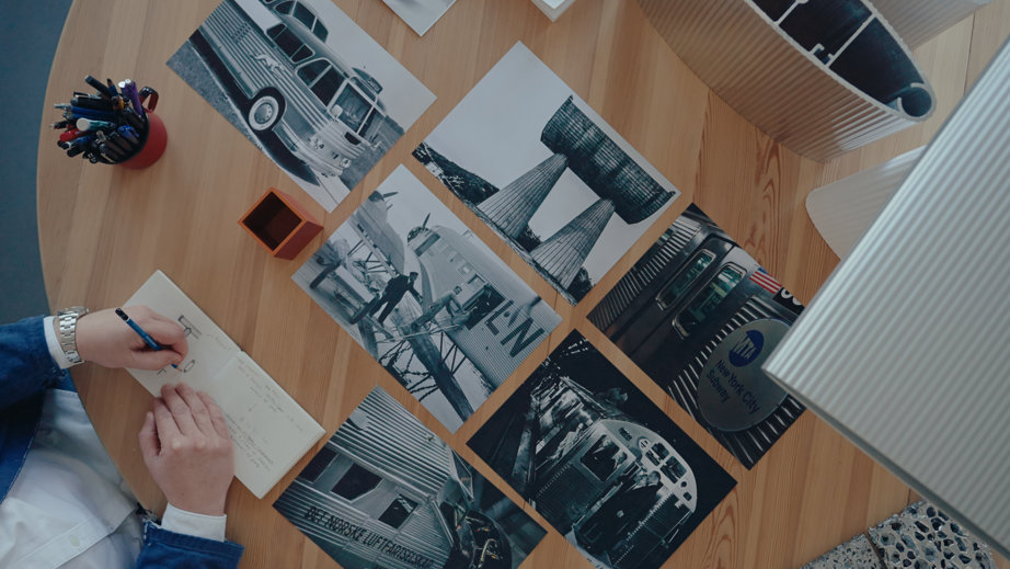 a person writing on a piece of paper