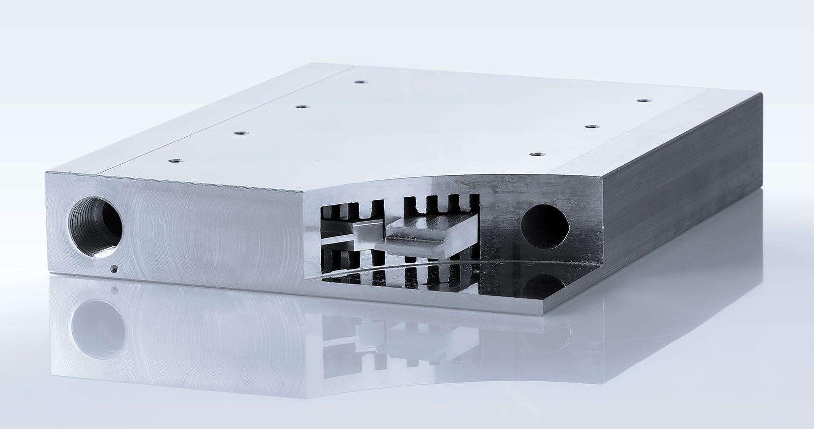 a white rectangular object with a black circle in the middle