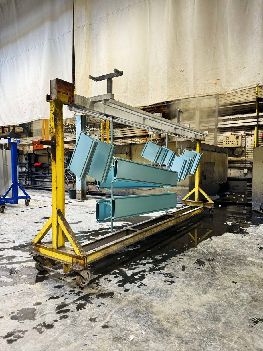 Philippe Malouin's T-board shelving system being anodized