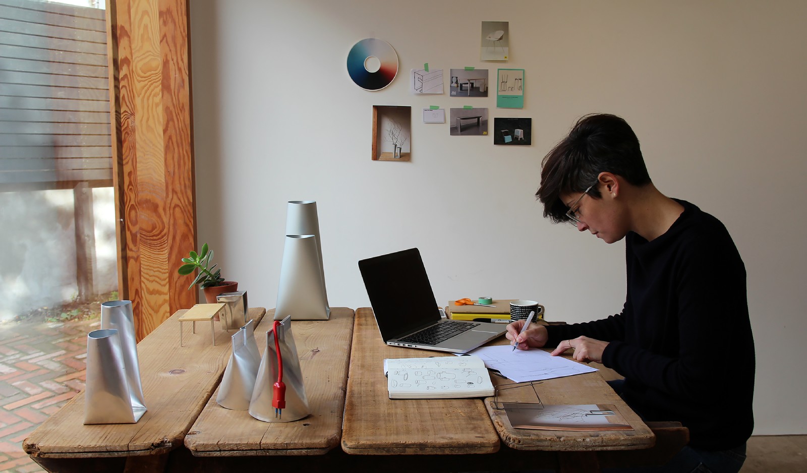 a man writing on a piece of paper