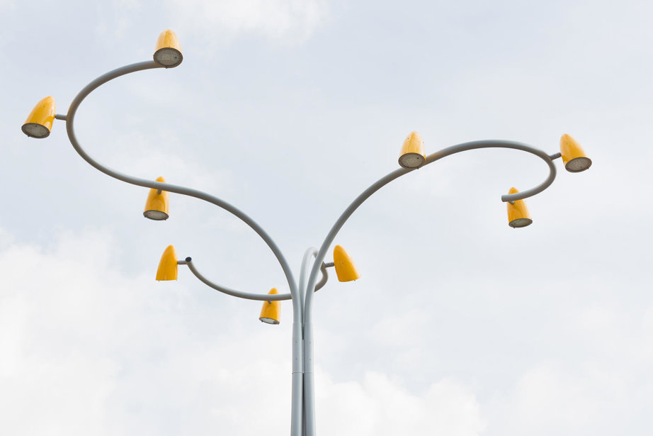 a street light with yellow lights