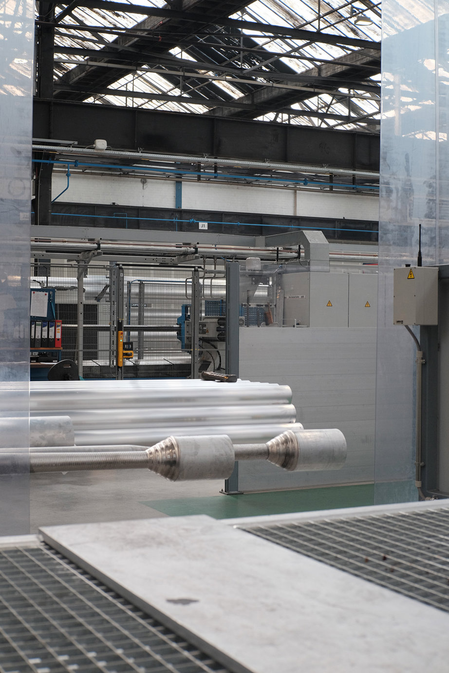 a large building with a large glass wall and a metal railing